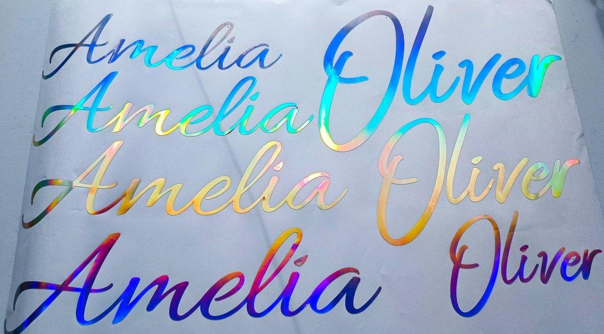 Personalized rainbow holographic vinyl name decals featuring names Amelia and Oliver in various styles.