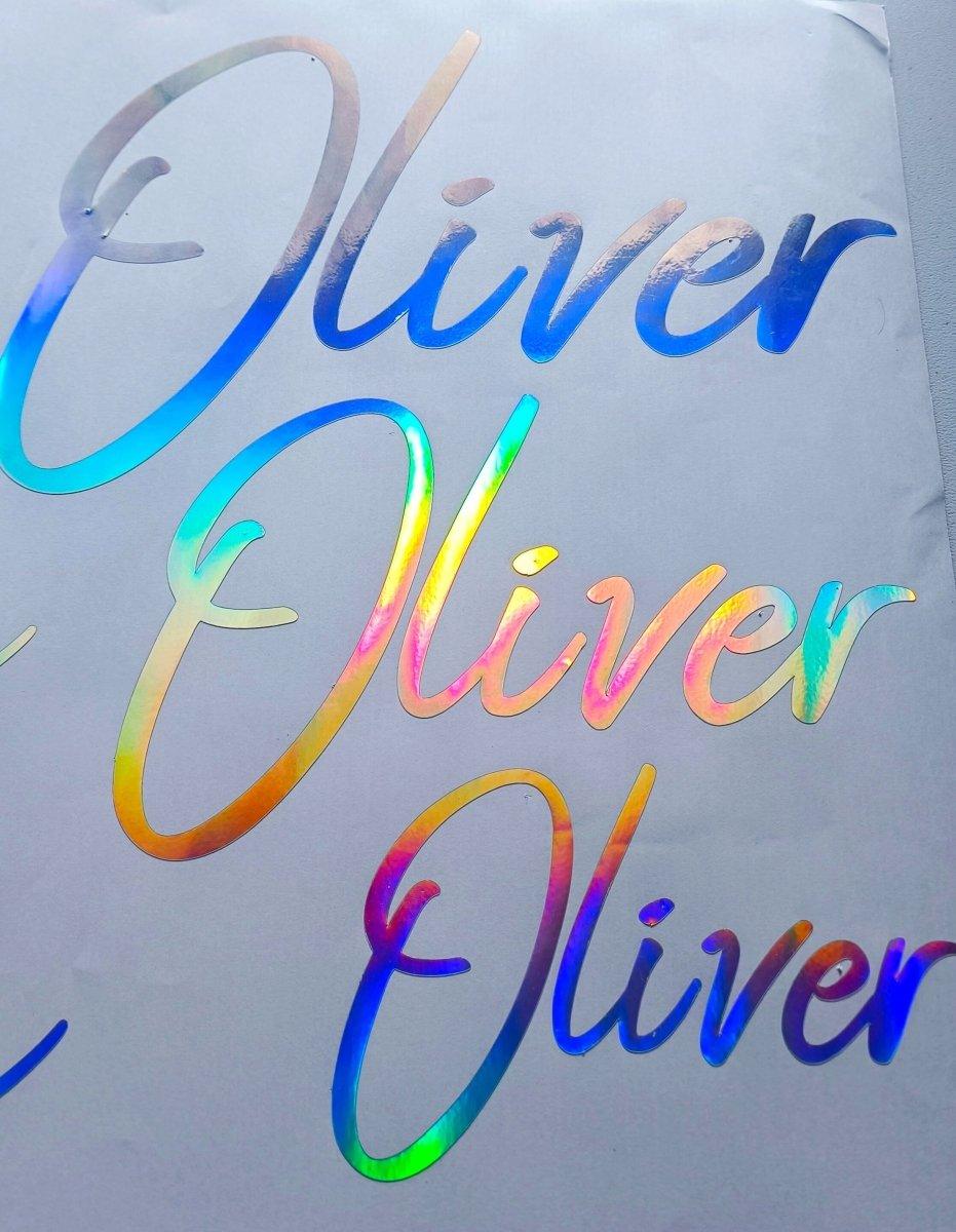 Personalized Rainbow Holographic Vinyl Decals featuring the name 'Oliver' in colorful cursive design.