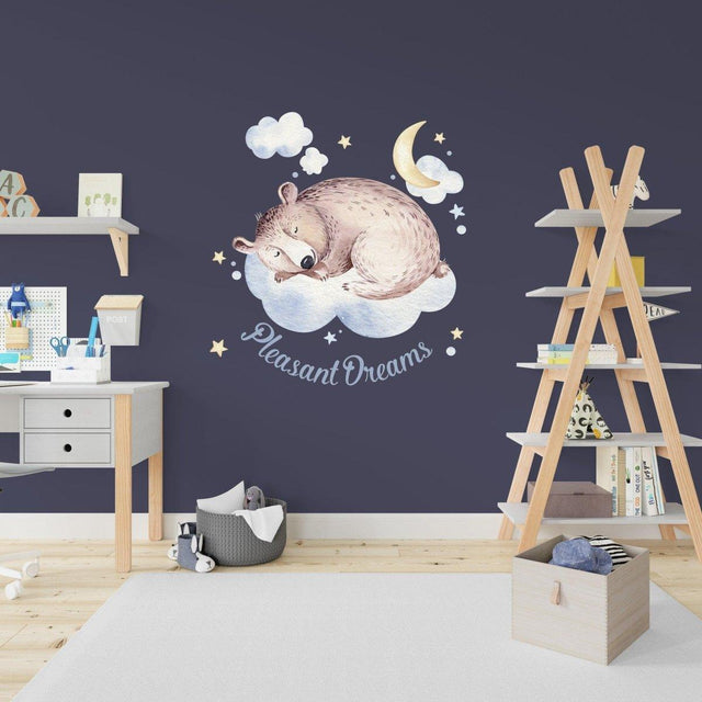 Adorable sleeping bear wall sticker with stars and moon, perfect for kids' room decor and creating a dreamy atmosphere.
