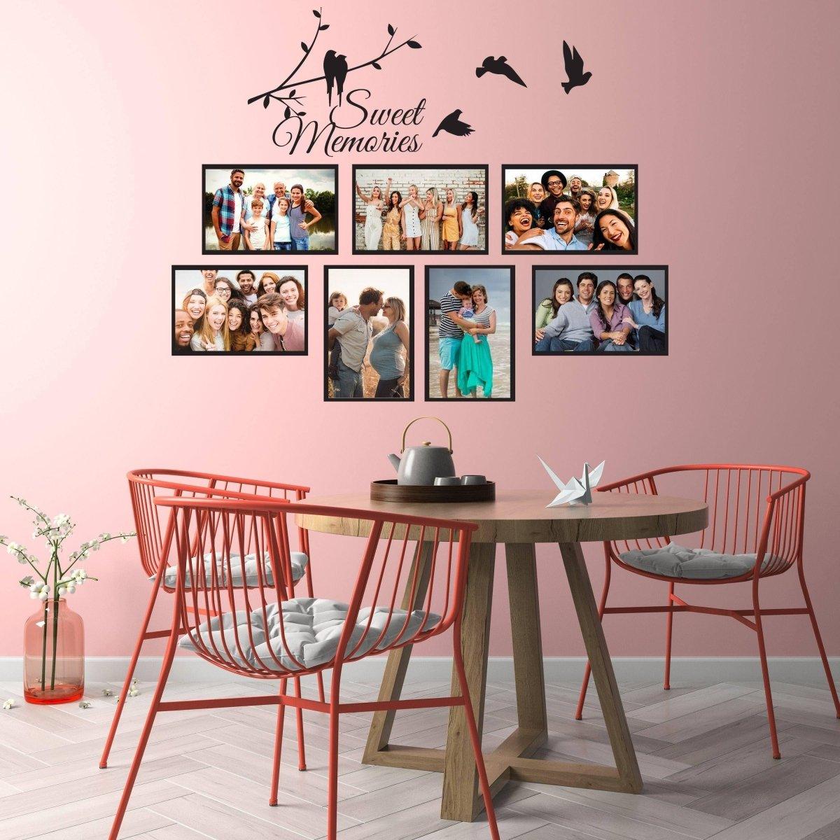 Stylish vinyl wall decal featuring photo frames and 'Sweet Memories' text on a pink wall in a modern dining room.