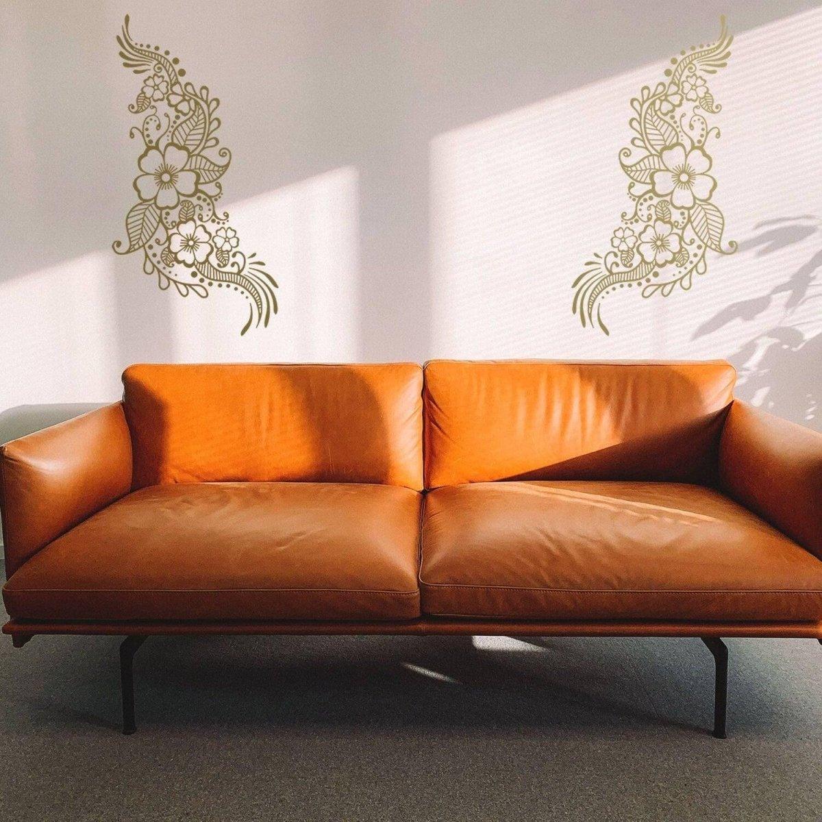 Henna art wall decals above a stylish brown leather sofa, adding elegance to interior decor.