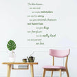 Inspirational wall decal with house rules in green lettering, enhancing home decor in a stylish living room.
