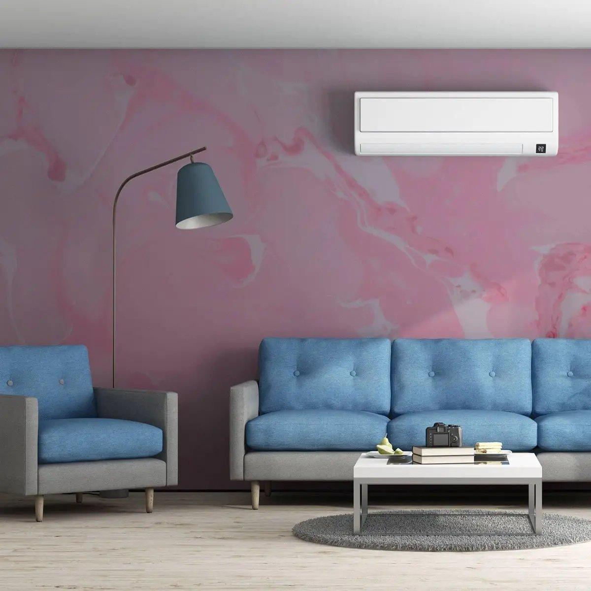 Elegant pink marble wallpaper accentuating a modern living room with blue sofas and minimalist decor.