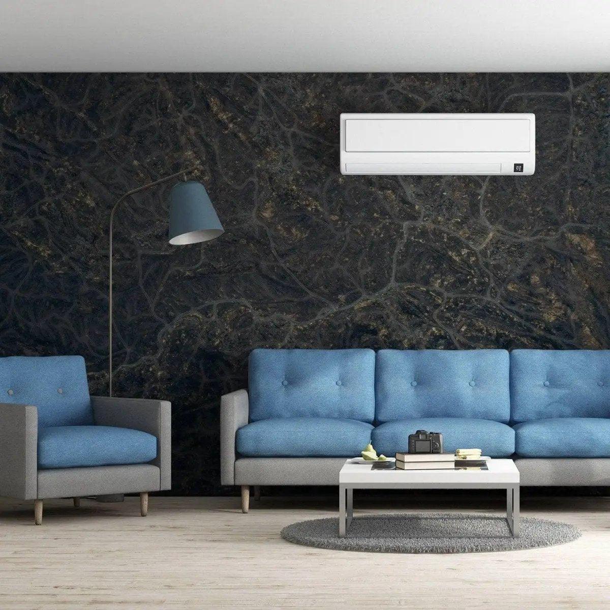 Stylish living room featuring marble effect wall covering, blue sofas, modern lamp, and air conditioning unit.