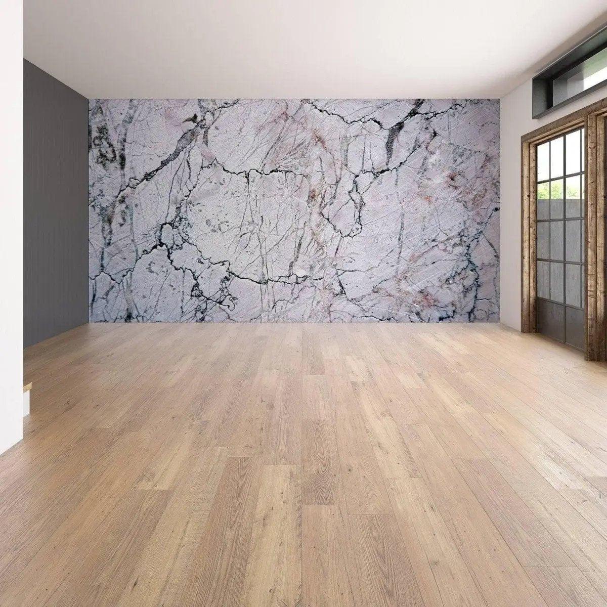 Elegant marble wall covering as a stunning focal point in a modern room with wooden flooring.