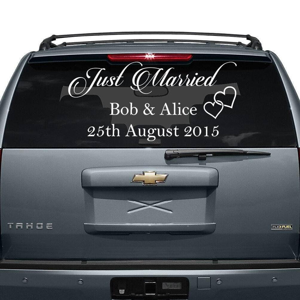 Just Married car decal on a vehicle's rear window, featuring custom names and wedding date.