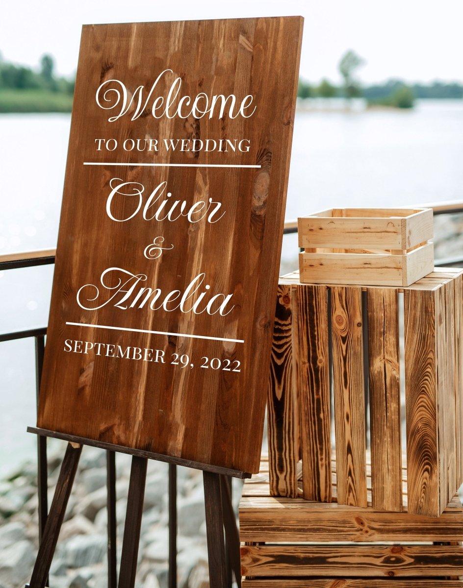 Personalized wooden wedding welcome sign with names Oliver and Amelia, dated September 29, 2022.
