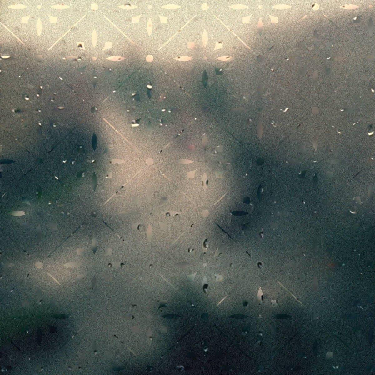 Frosted geometric window decal with raindrops, providing stylish privacy while allowing natural light.