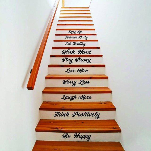 Vinyl decals with inspirational quotes on wooden staircase for stylish home decor.