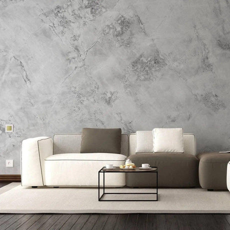 Stylish living room featuring stone texture self-stick wallpaper, modern furniture, and a minimalistic coffee table.