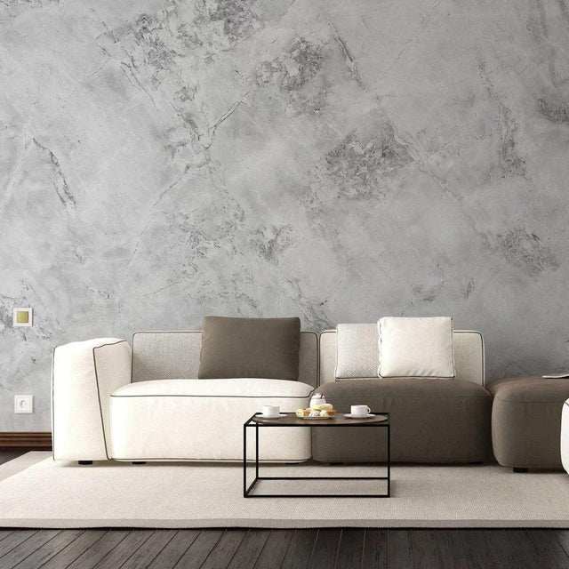Stylish living room featuring stone texture self-stick wallpaper, modern furniture, and a minimalistic coffee table.
