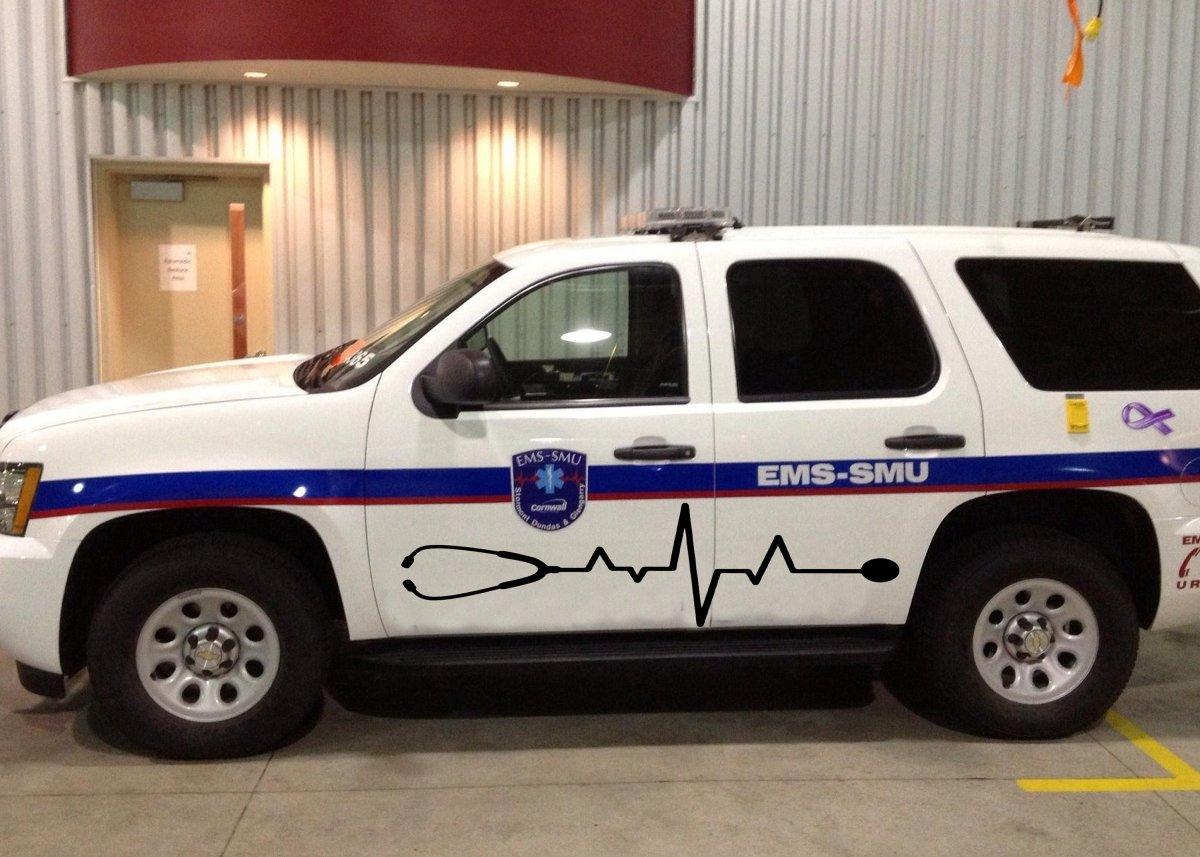EMS-SMU ambulance vehicle with medical heartbeat design on the side, showcasing emergency medical services.