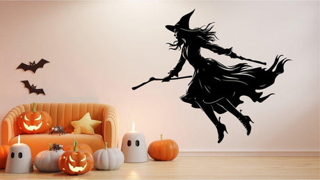 Flying witch broom silhouette decal on a wall with Halloween decorations and pumpkins, creating a spooky atmosphere.