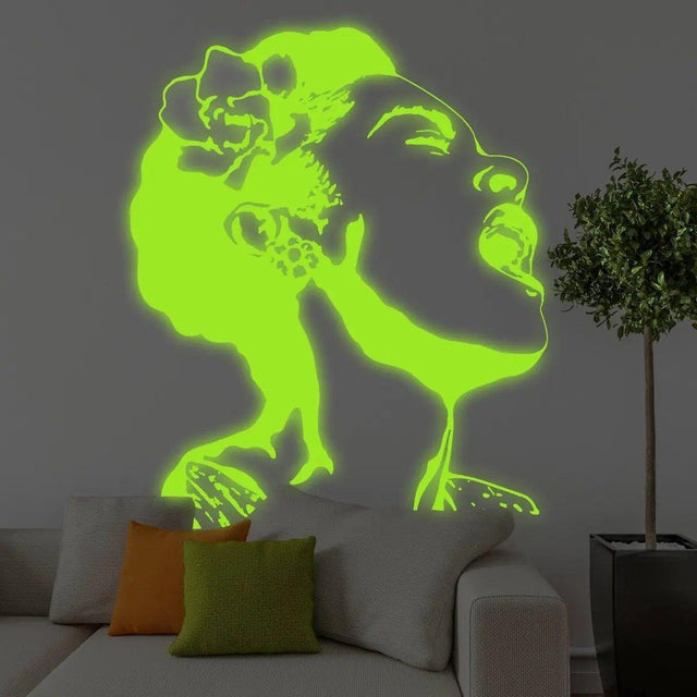 Glow in the dark wall decal of a woman singing, illuminating a modern living room with vibrant colors.