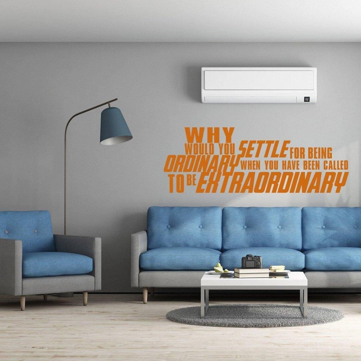 Inspirational wall sticker saying 'Why settle for being ordinary when you have been called to be extraordinary' on a grey wall.