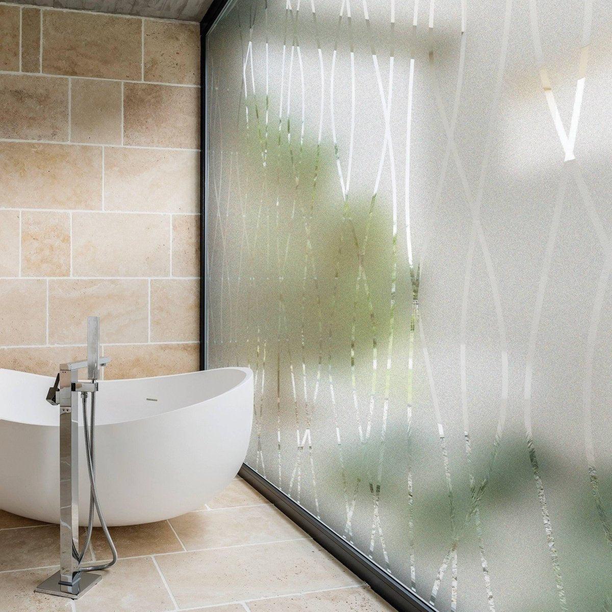 Frosted glass door sticker with elegant design in a modern bathroom, offering privacy and natural light.