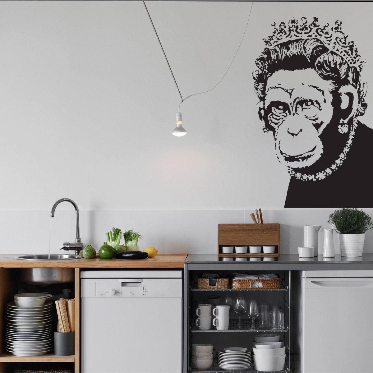 Queen Monkey vinyl wall art decal in a modern kitchen, adding humor and personality to home decor.