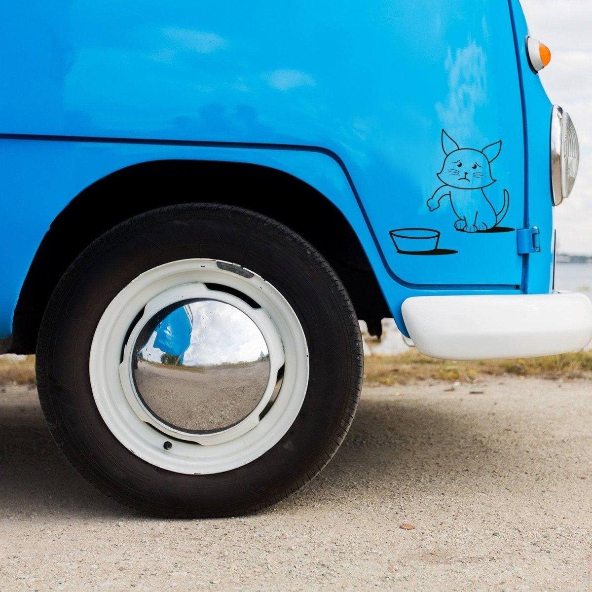Cute cat vinyl decal on a blue vehicle, adding playful personality to the car. Perfect for cat lovers!