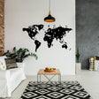 Wanderlust Vinyl Sticker featuring a world map wall decal in a modern living room decor.