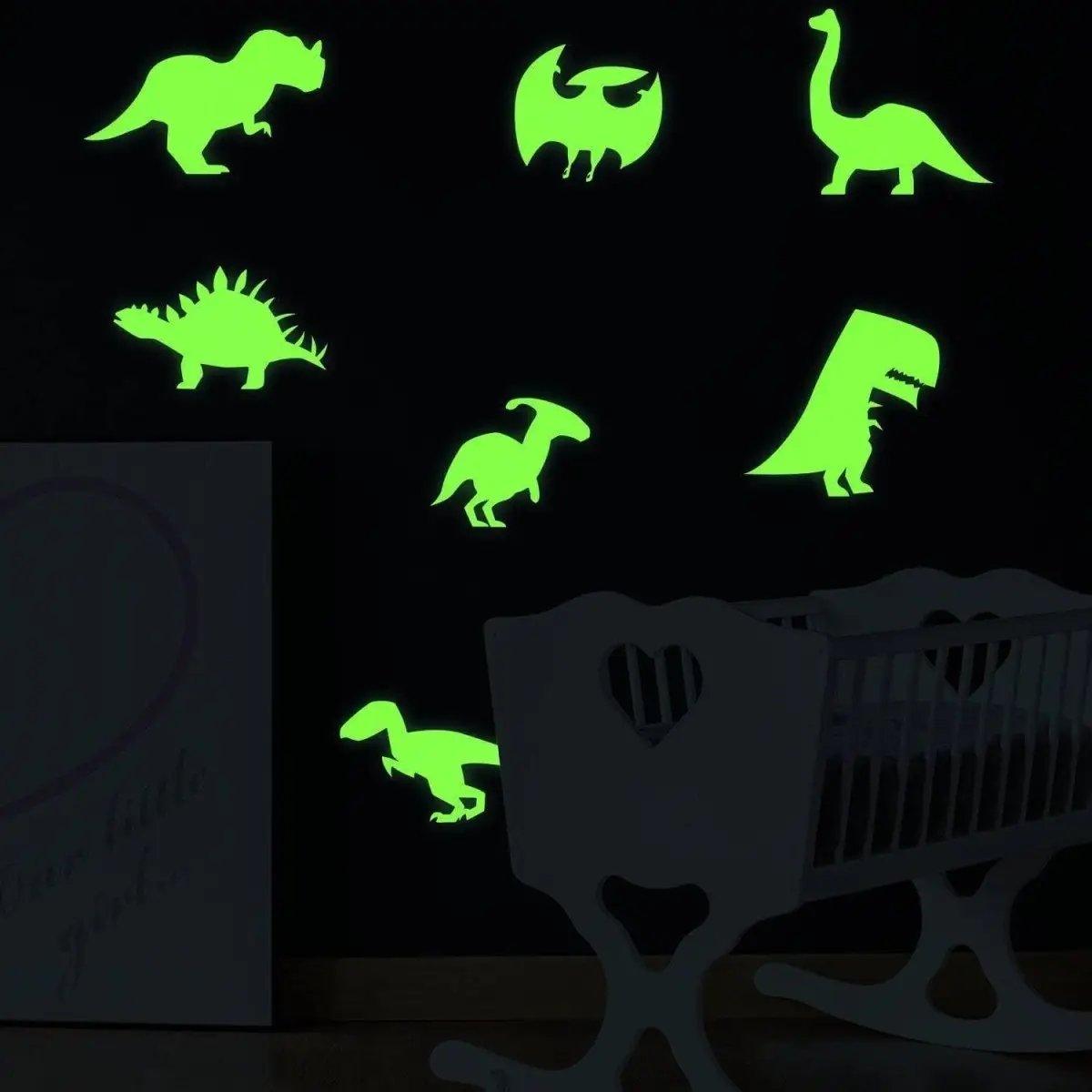 Glow-in-the-dark dinosaur wall decals in a nursery, featuring various prehistoric designs for enchanting decor.