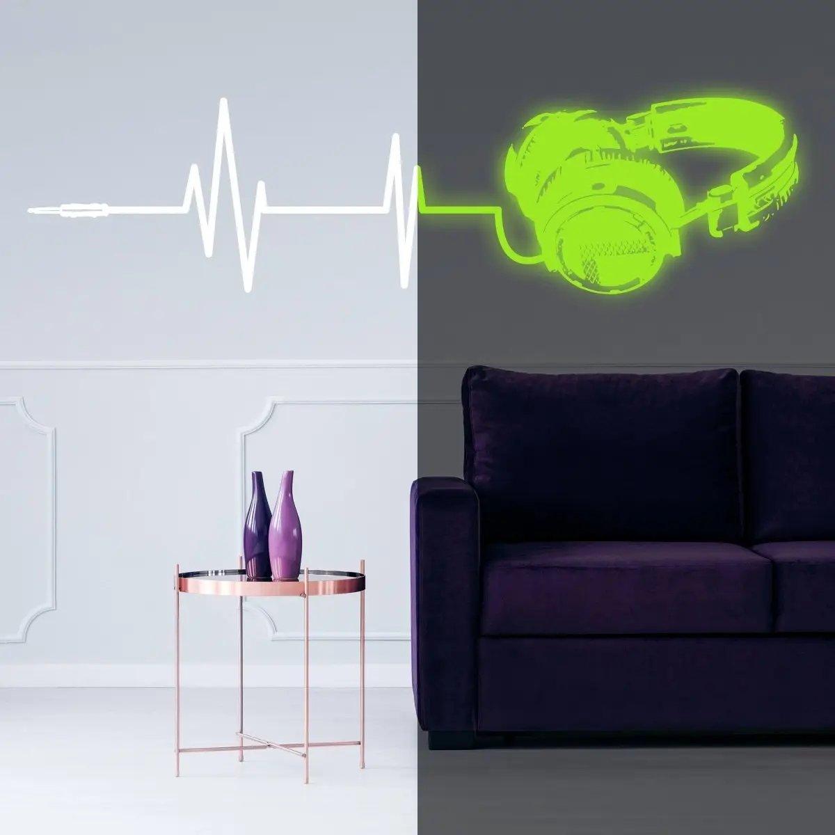 Luminous vinyl wall decal featuring glowing headphones and soundwave design in a stylish living room setting.