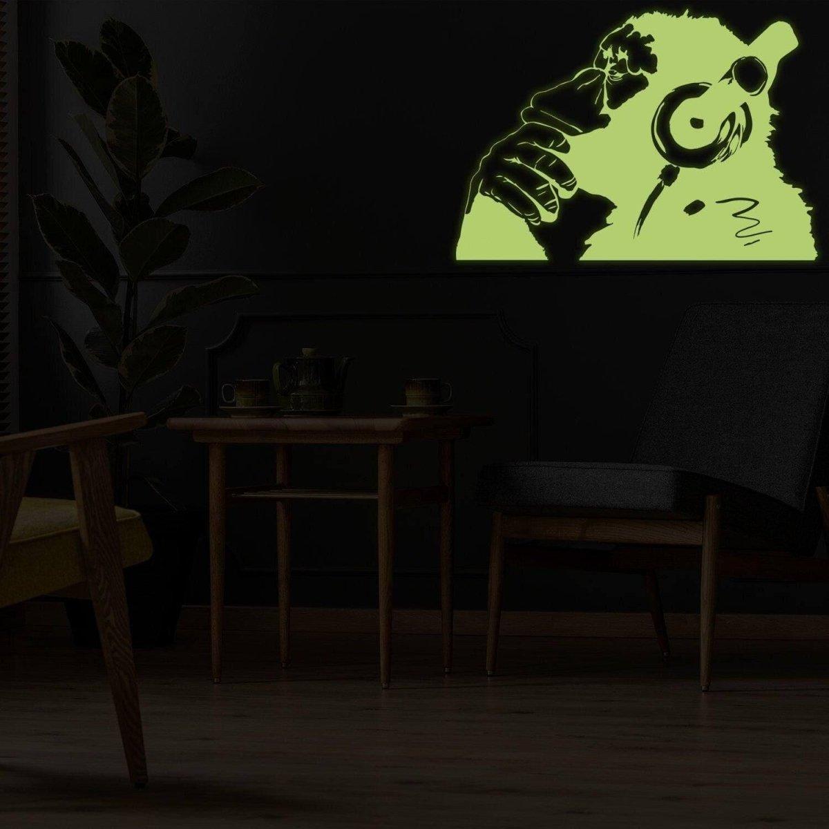 Glowing vinyl wall decal of a monkey wearing headphones, luminescent graffiti sticker for modern decor.