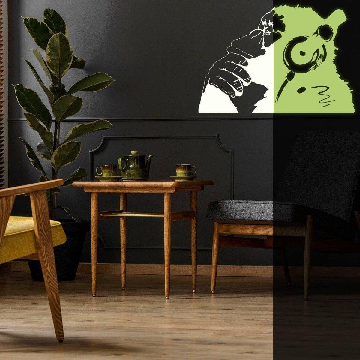 Glowing vinyl wall decal of a monkey with headphones in a stylish living space, enhancing home decor with creativity.