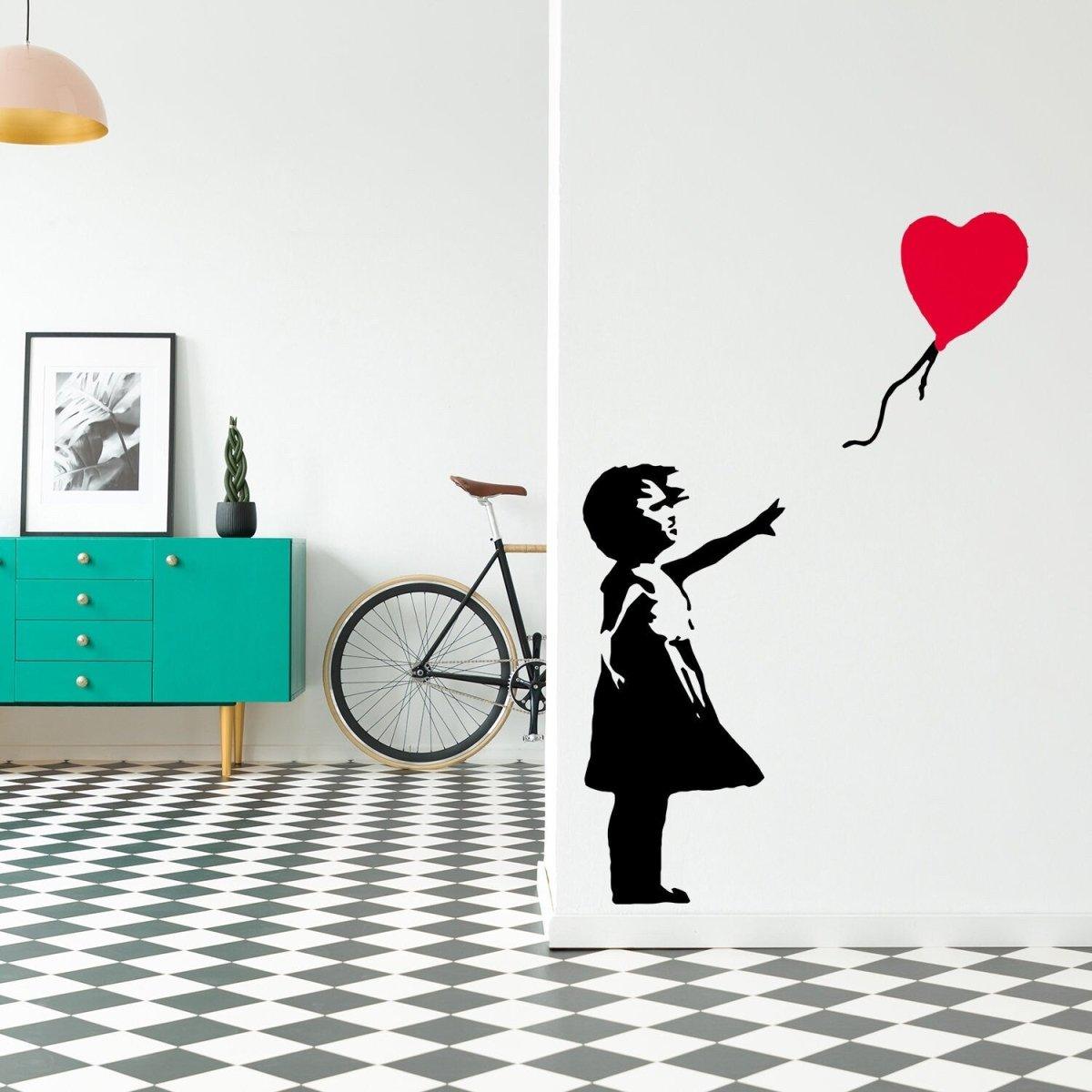 Banksy-inspired girl with heart balloon wall decal in modern interior, adding a creative touch to any space.