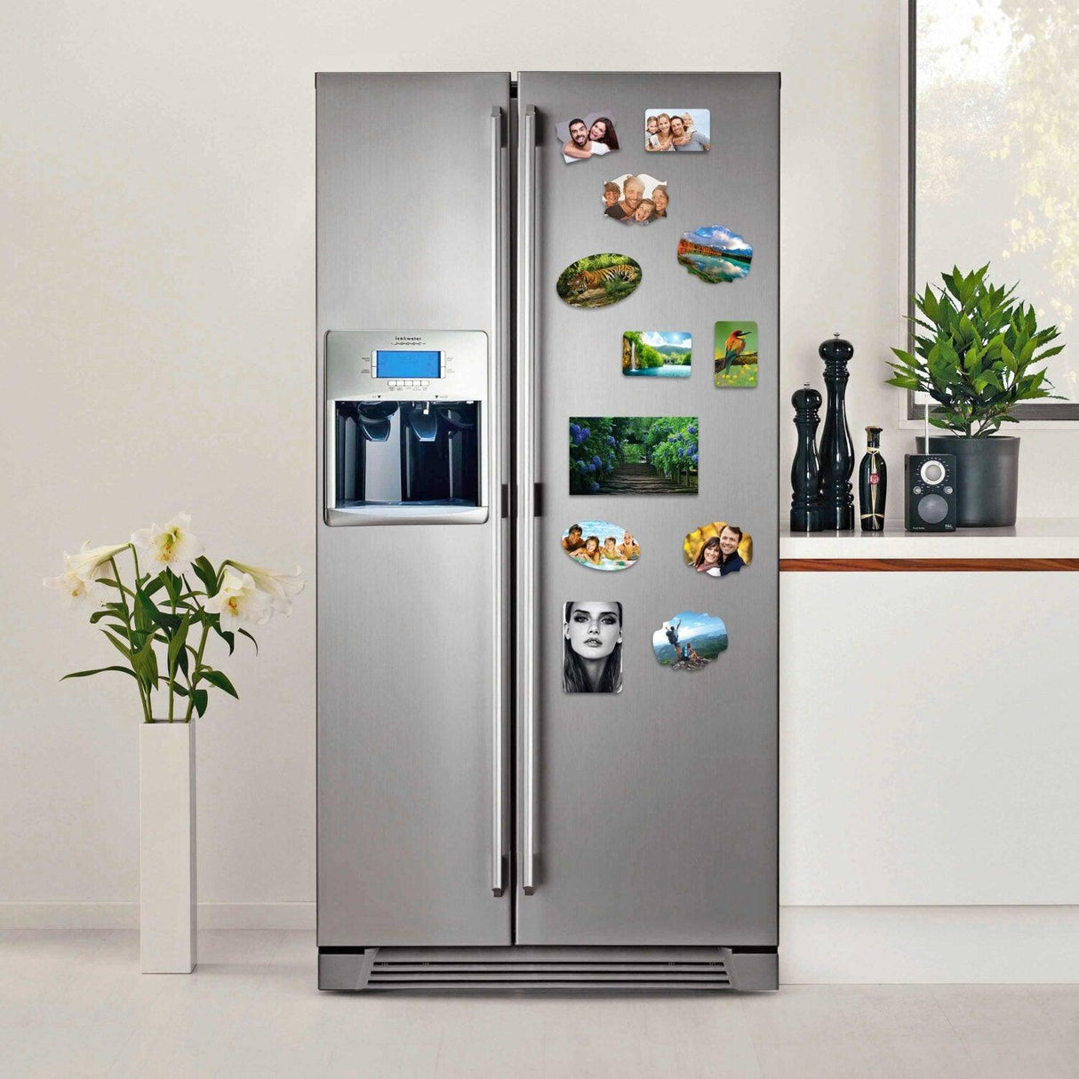 Modern kitchen with a stainless steel refrigerator displaying personalized photo magnets.