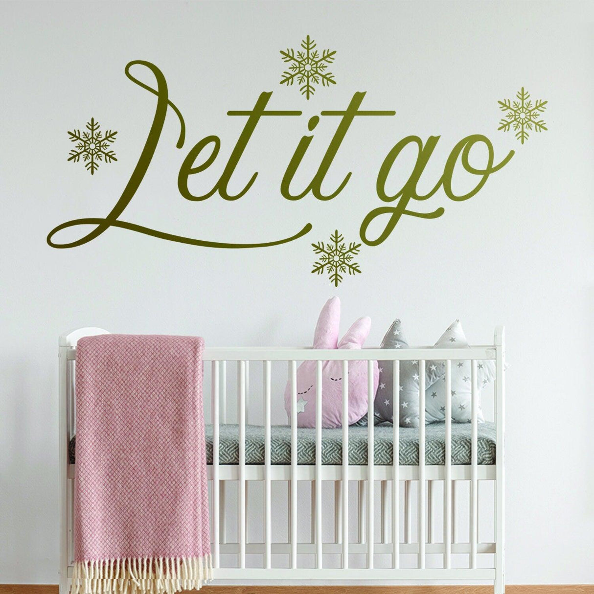Let It Go quote wall sticker with snowflakes in a nursery, promoting positivity and mindfulness.