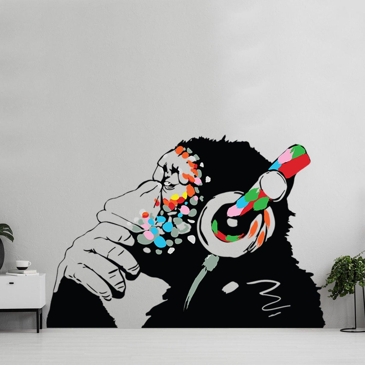 Vibrant wall decal of a thoughtful monkey wearing colorful headphones, adding personality to any space.