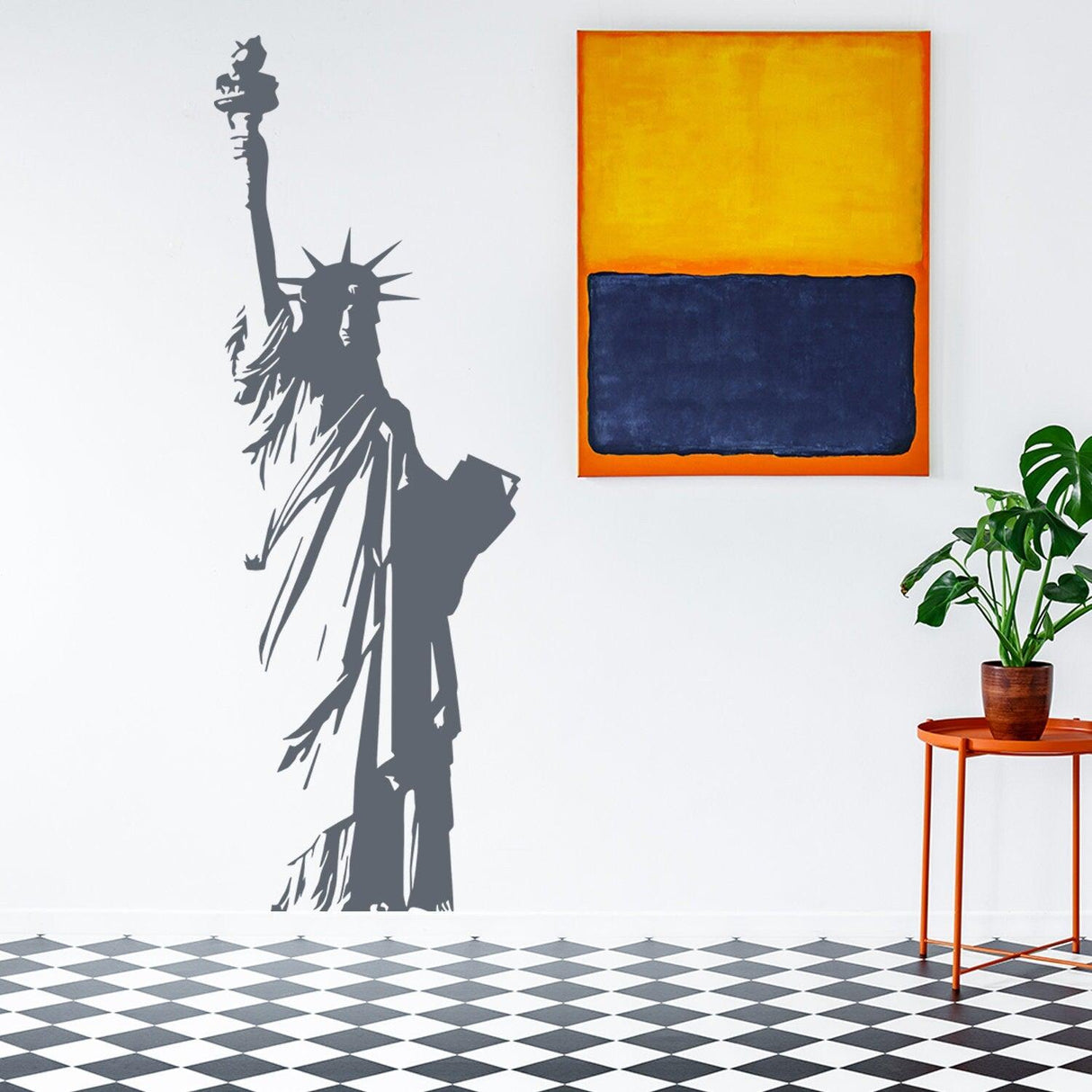 Stylish wall decal of the Statue of Liberty, symbolizing freedom, alongside modern art and indoor greenery.