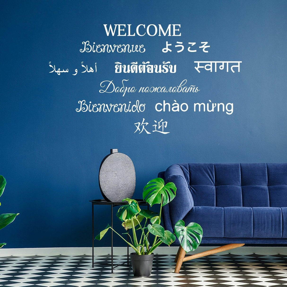 Decorative wall with 'Welcome' in various languages and modern couch, creating a warm entryway atmosphere.