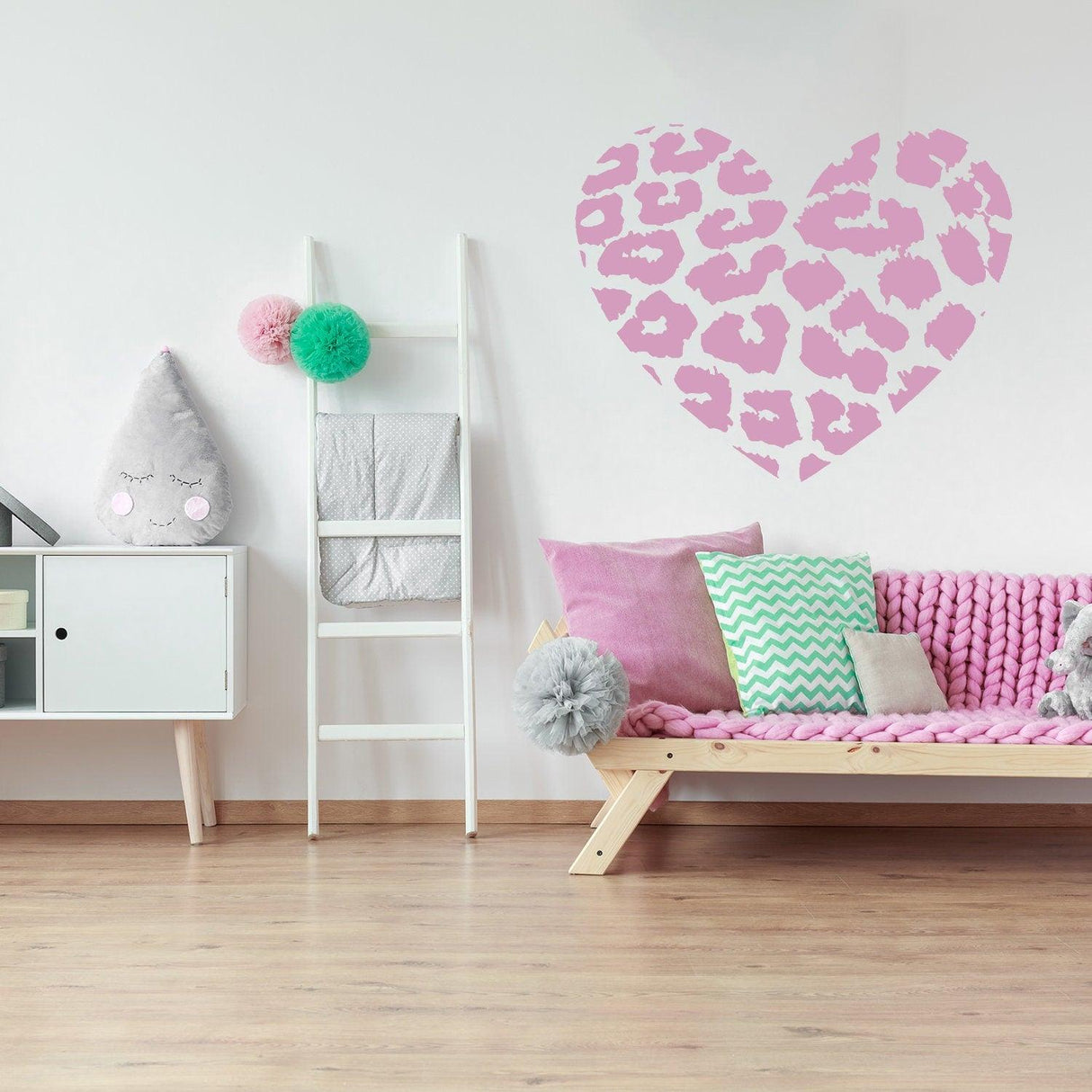 Leopard heart wall sticker in a stylish room with pink decor and cozy seating, perfect for home decoration.