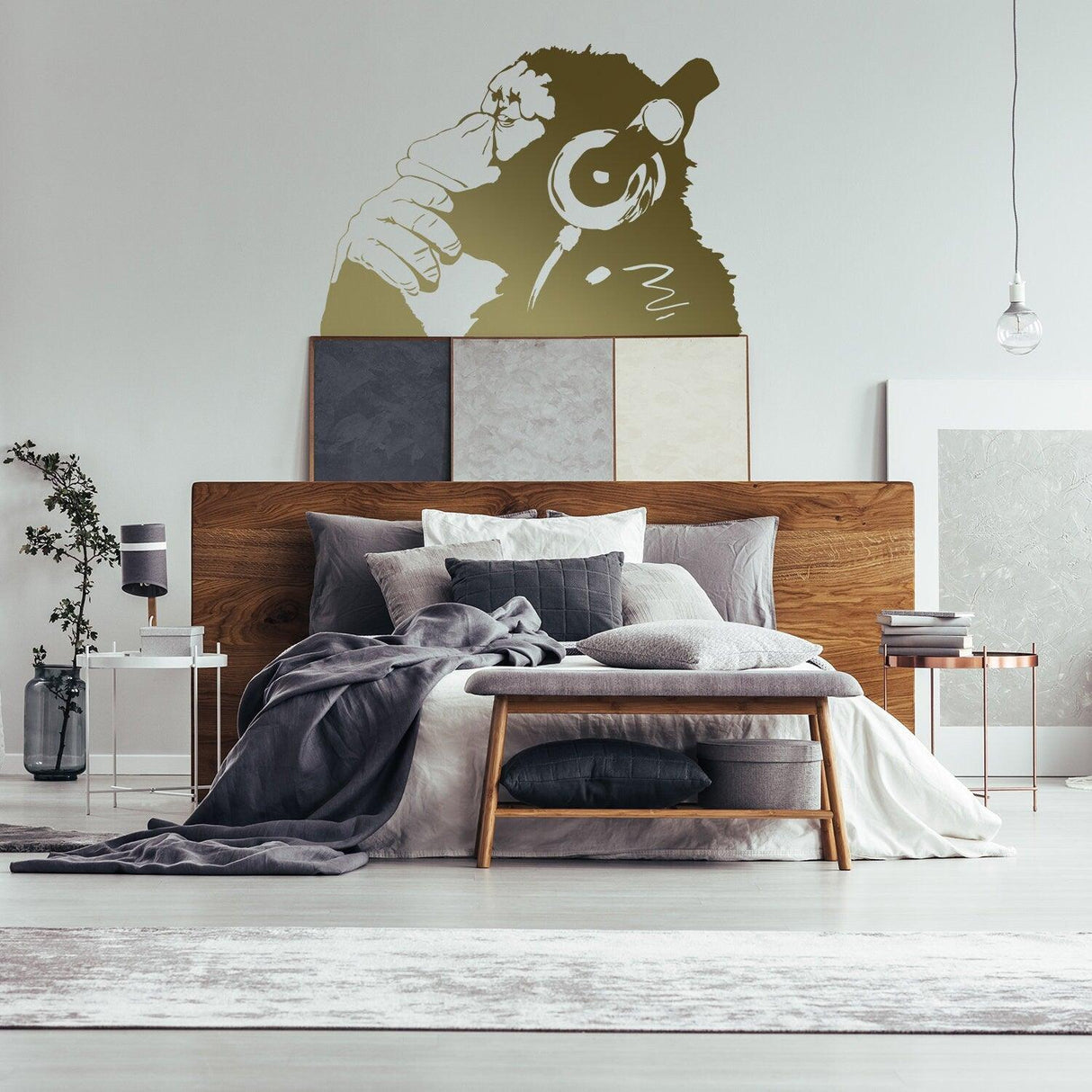 Banksy Thinking Monkey Wall Sticker in modern bedroom decor, featuring a thoughtful monkey graphic above a stylish bed.