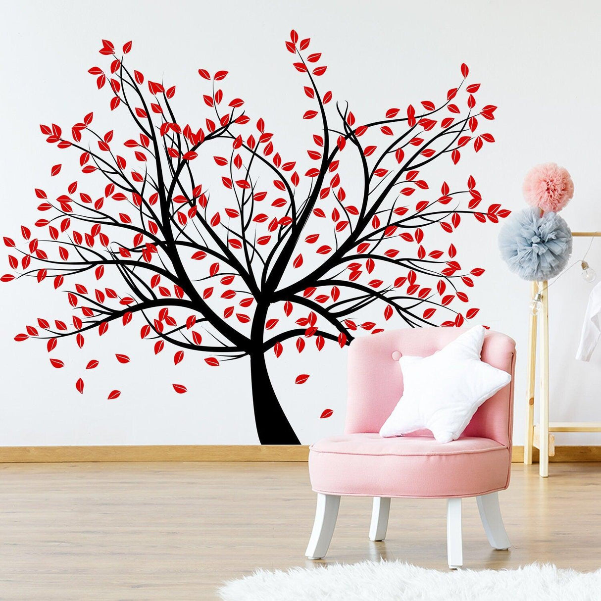 Birch tree wall decal with red leaves in a nursery, enhancing decor with a nature-inspired design.