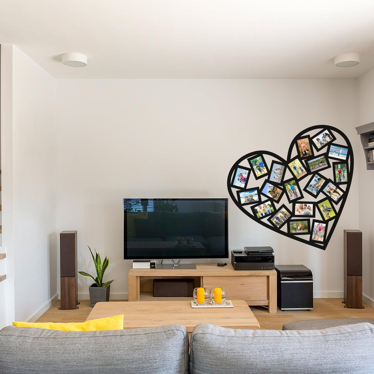 Heart-shaped photo frame wall sticker showcasing cherished memories in a stylish living room.