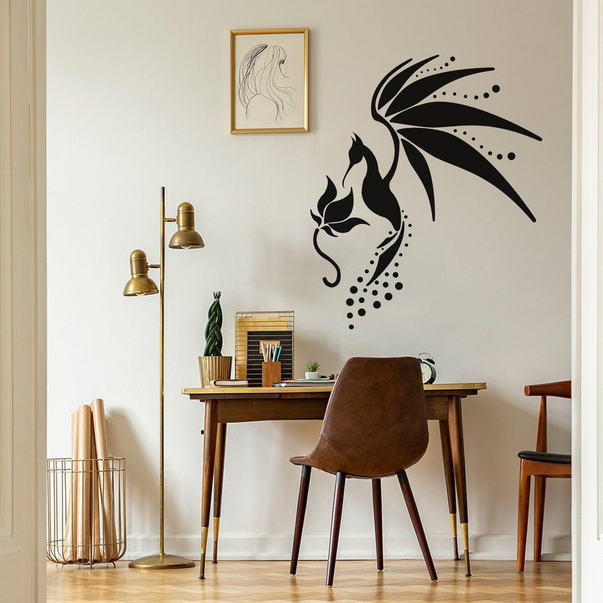 Stylish black wall decal of a bird and cat in a modern home office with wooden desk and chair.