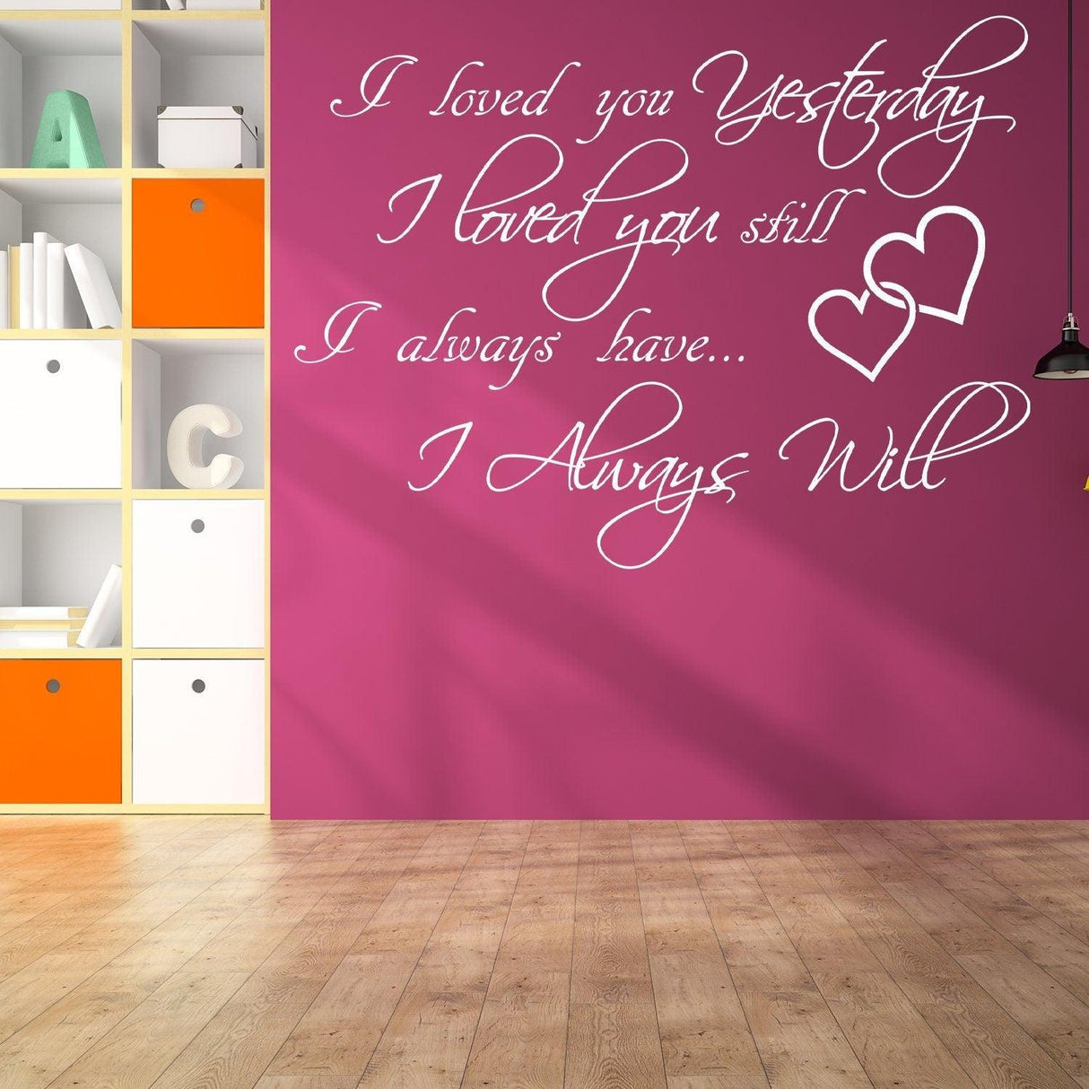 I Love You Yesterday wall sticker in cursive on pink wall, expressing timeless love with heart design.