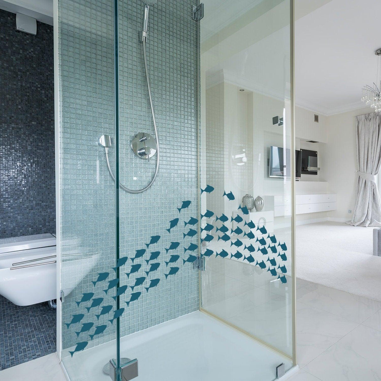 Colorful fish vinyl wall sticker in a modern shower, adding ocean-themed decor to the bathroom.