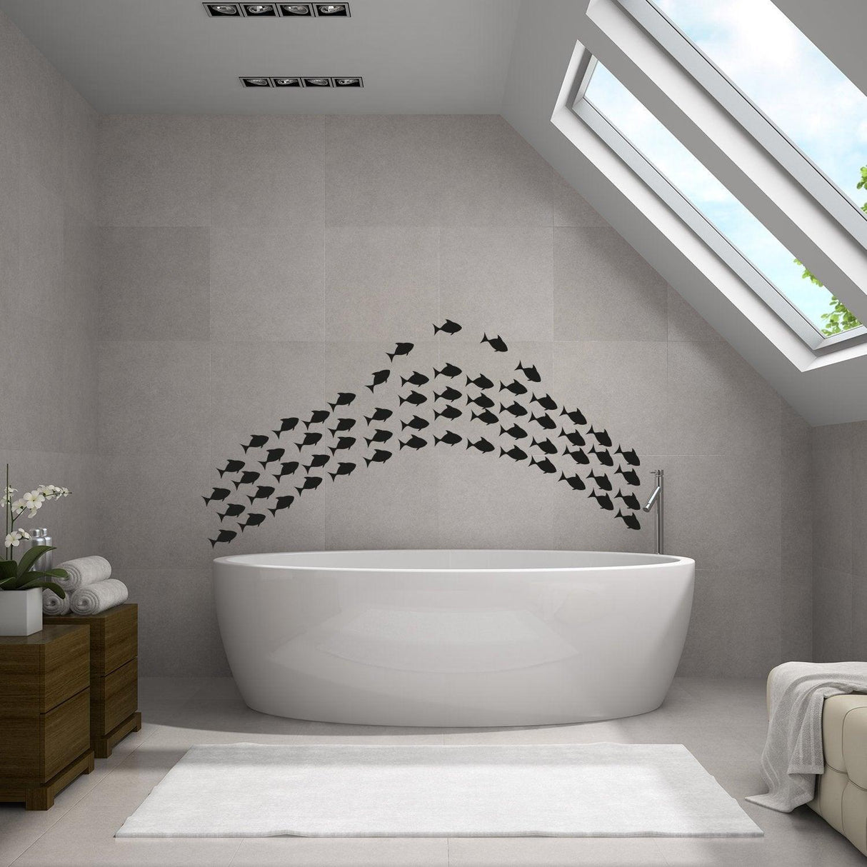 Fish vinyl wall sticker set decoration above a modern bathtub in a stylish bathroom with natural light.