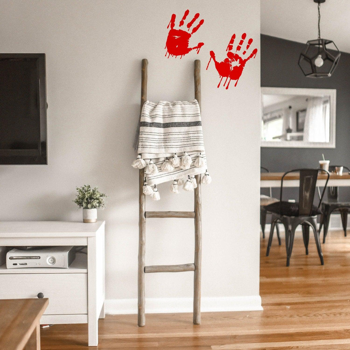 Bloody Hands Scary Red Vinyl Sticker on a wall with a wooden ladder and decor in a modern living space.