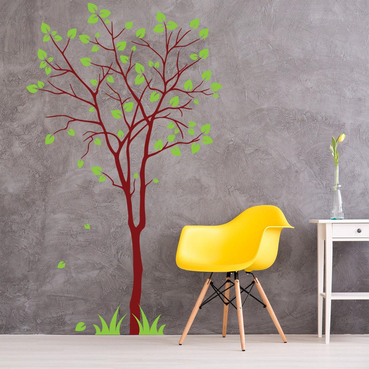 Colorful birch tree wall decal with green leaves in a modern nursery setting.