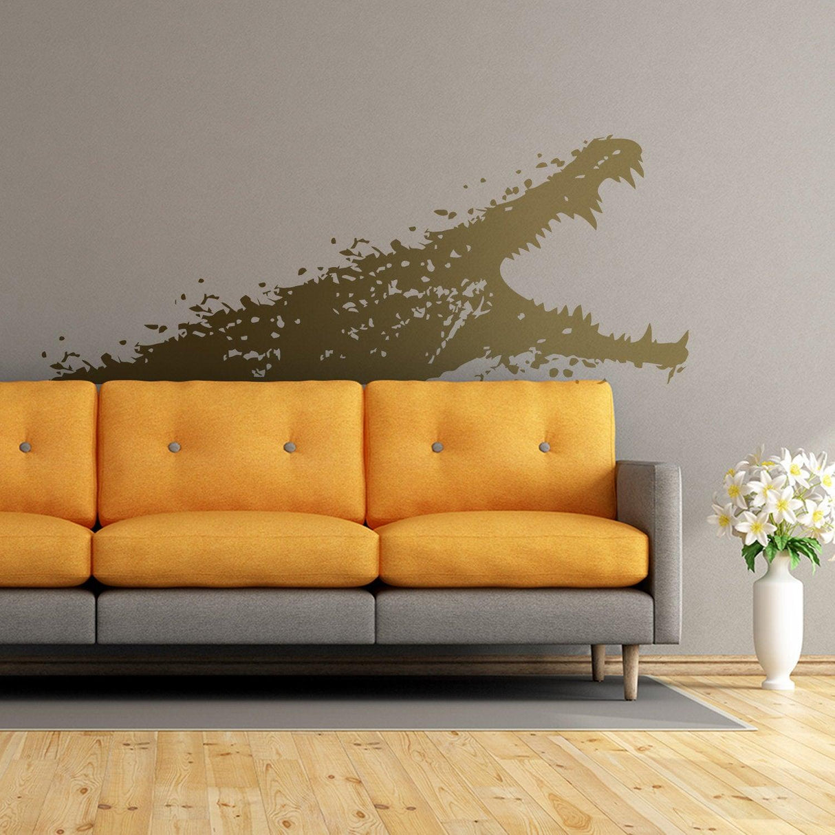 Aligator wall sticker in green on a gray wall above an orange couch, adding whimsical decor to the living room.