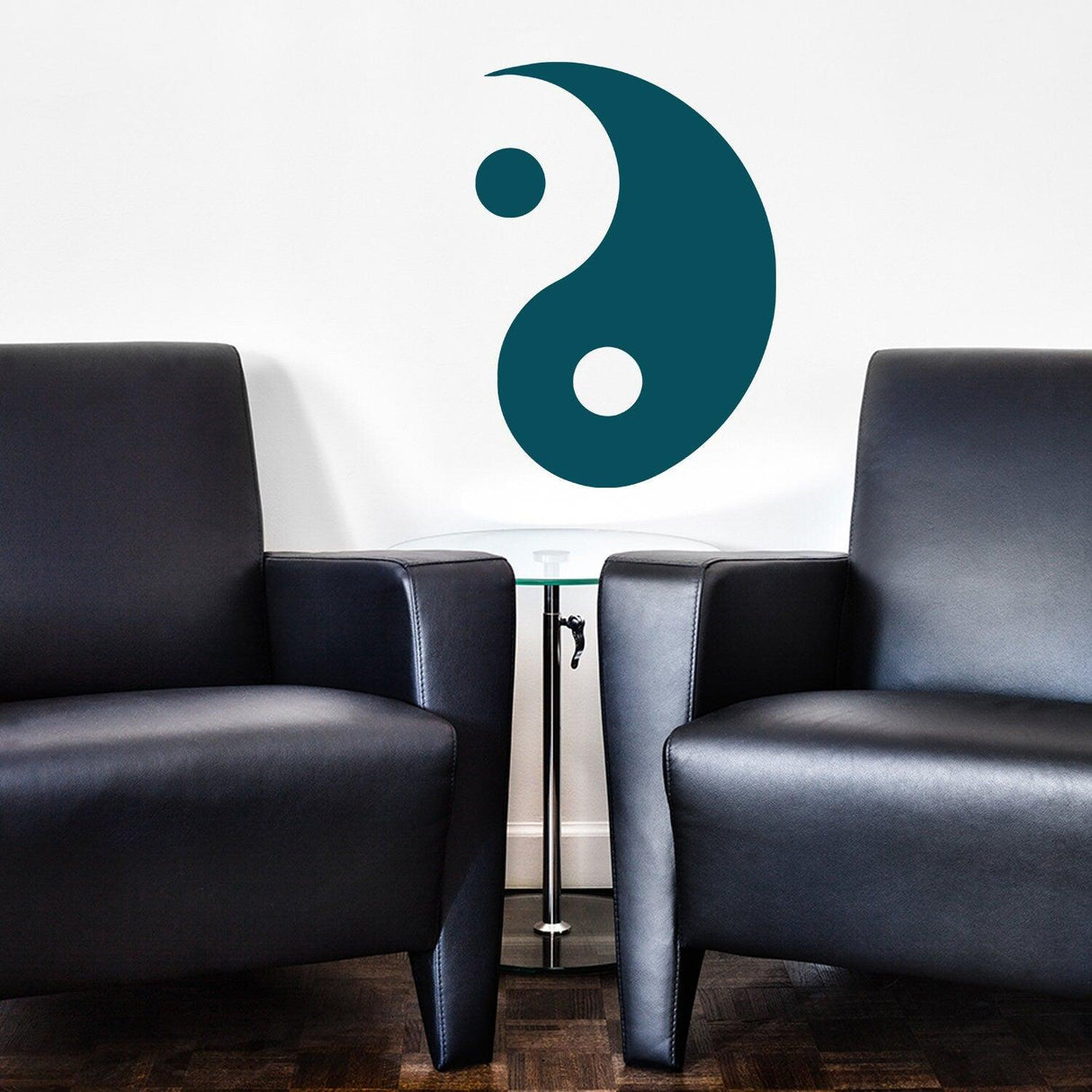 Yang Yin wall sticker decal in teal above modern black armchairs in a stylish living room.
