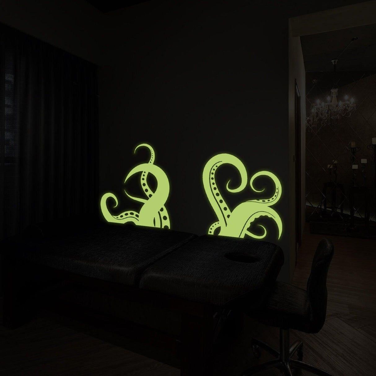 Glow in the dark octopus tentacle vinyl wall art sticker in a dimly lit bathroom setting.