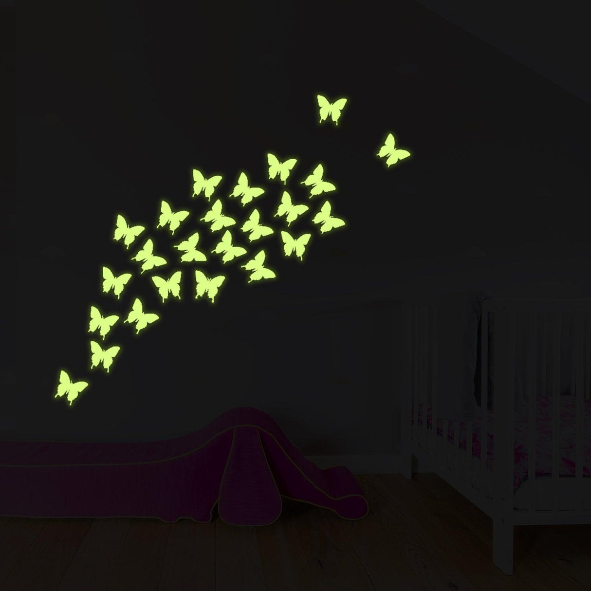 Glow-in-the-dark butterfly decals on a wall, creating a magical ambiance in a child's room.