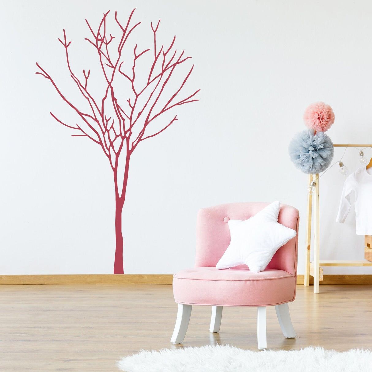 Wall-mounted birch tree sticker decal in pink, enhancing the nursery's decor with natural elegance.
