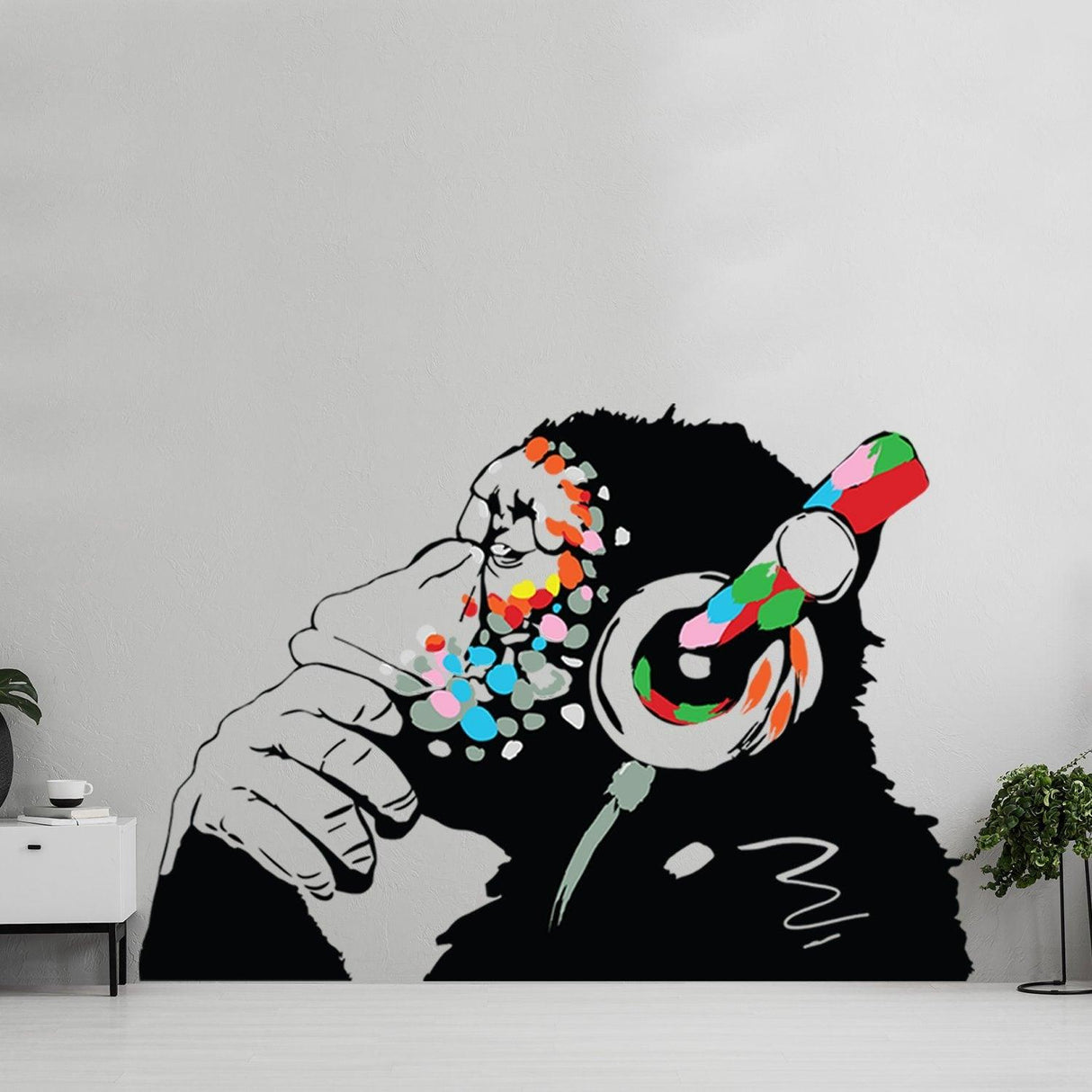 Banksy Thinking Monkey sticker art decal featuring a monkey with colorful headset and deep in thought.
