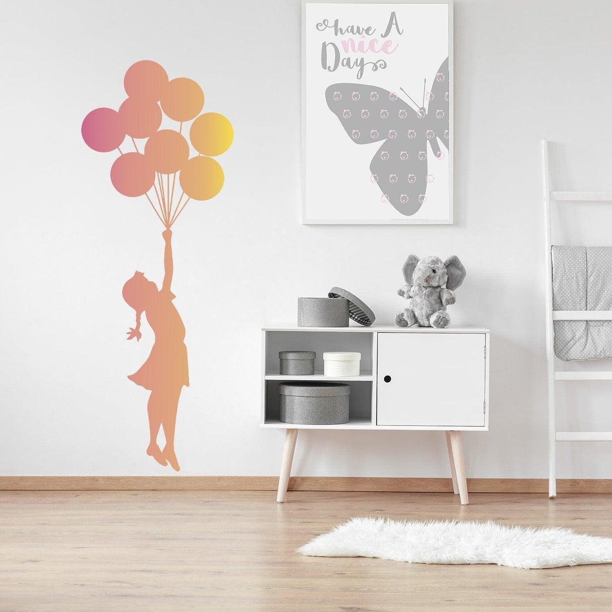 Balloon Girl Banksy wall sticker in nursery with colorful balloons and stylish decor.